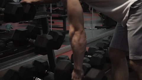 Dumbbell row of fit guy Video stock 117910064