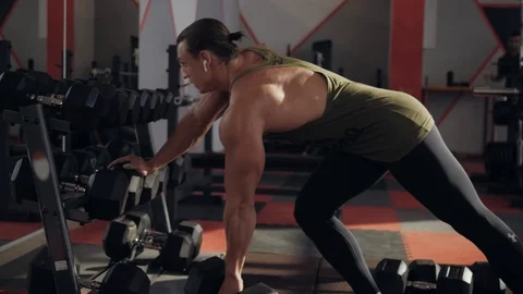Dumbbell row of fit guy Stock Footage 118073812