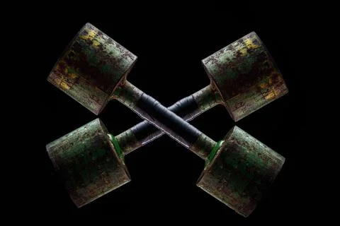 Dumbbells on a black background Stock Photos