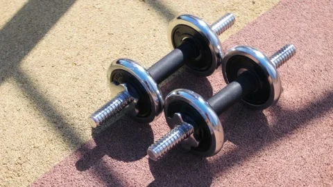 Dumbbells on floor in closeup Video stock 160829634