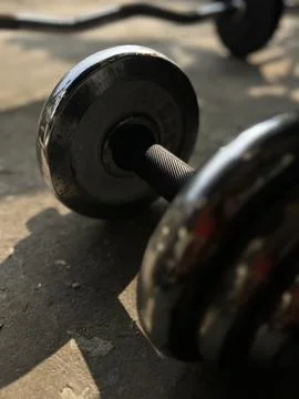 Dumbbells on the floor Stock Photos