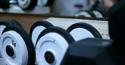 Dumbbells in gym Stock Footage 67326180