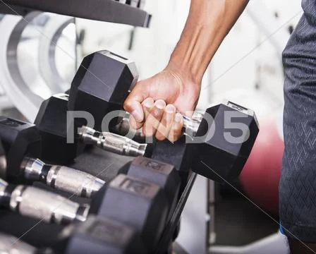 Dumbbells in gym Stock Photos