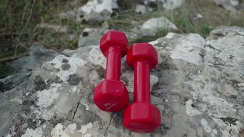 Dumbbells lie on a close-up stone Stock Footage 234144015