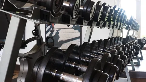Dumbbells on the rack in the gym Stock Footage 93602865