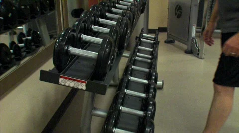 Dumbells being picked up off the rack - PAL 스톡 동영상 641201