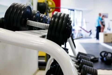 Dumbells in a gym Stock Photos