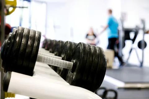 Dumbells in a gym Stock Photos