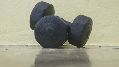 Dumbells in the Rain Stock Footage 137758235