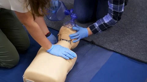 Dummies for medics used for first aid trainings. Oxigen masks near medical dolls Stock Footage 144009733