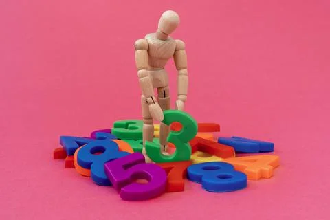 Dummy with a colored numbers on  red background Stock Photos