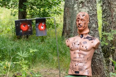 Dummy man and target with multiple bullet holes from a traumatic gun Stock Photos