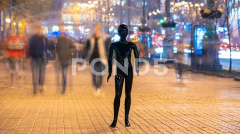 The dummy standing on the crowd street. evening time Stock Photos
