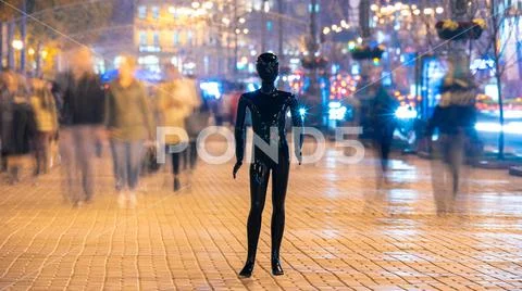 The dummy standing on the crowd street. evening time Stock Photos