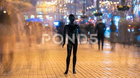 The dummy standing on the crowd street. evening time Stock Photos