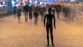 The dummy standing in an evening street with a people stream. time lapse 4k or 4k+ Resolution