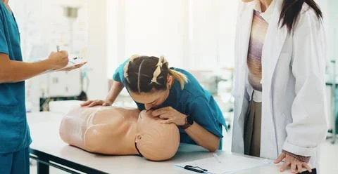Dummy, students and cpr training in hospital for medical simulation exam, test Stock Photos