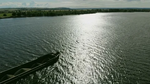 A dump scow transports sand down the river. Stock Footage 142073271