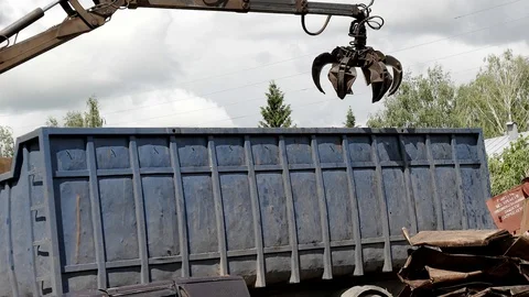 Dump of scrap metal and old cars. Loading crane manipulator Stock Footage 90859301