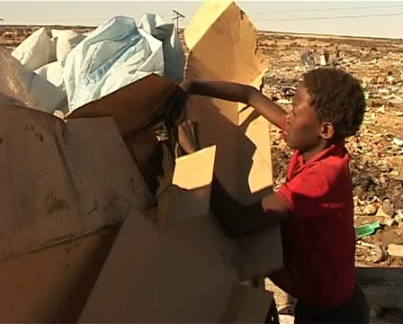 A dump site kid make a shak Stock Footage 11496976