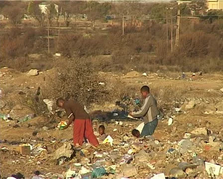 Dump site kids looking through the rubbish Stock Footage 11496319