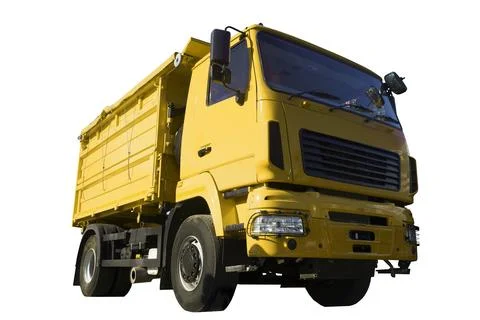 Dump track isolated. Yellow construction truck on empty background. Heavy Stock Photos
