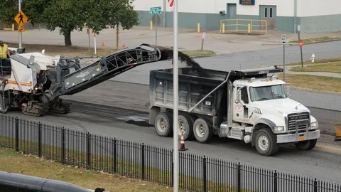 Dump truck being filled with ready mix asphalt Stock-Footage 89382820
