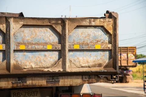 Dump truck delivery process construction site vehicle close-up urban enviro.. Stock-Fotos