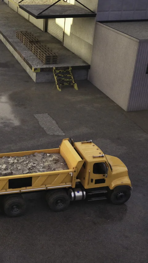 Dump truck drives near loading dock at construction site in daylight Stock Footage 331661194