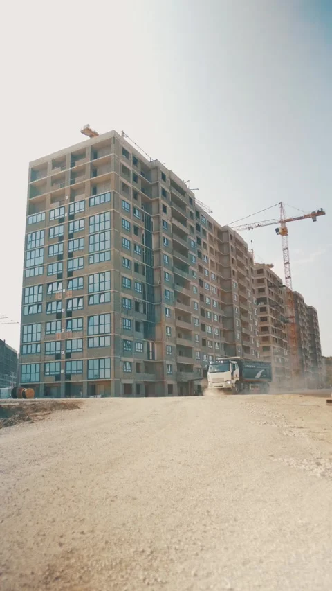 A dump truck is driving through the construction site and comes to a sudden stop 動画素材 346703372