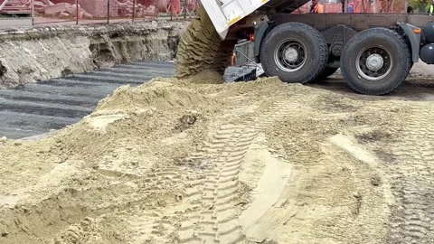 The dump truck is dumping sand Stock Footage 220888118