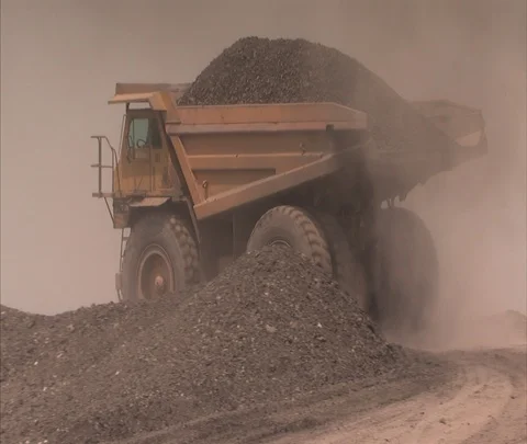 Dump truck dumps load of coal at Century Mine Stock Footage 86695921