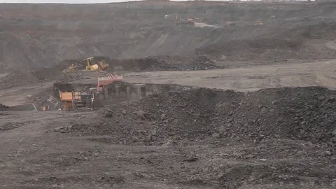 Dump truck passes by excavator  (open pit) Stock Footage 83535738