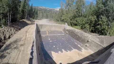 Dump truck rides empty. Road works Stock Footage 96579421