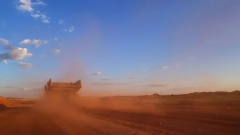 Dump truck rides on the road to the quarry. Moving camera Stock Footage 73379563