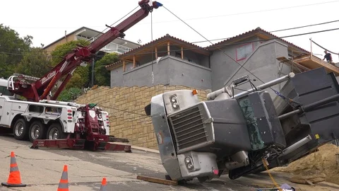 A dump truck rolls over during an accident on a construction site. 库存影片 107443200