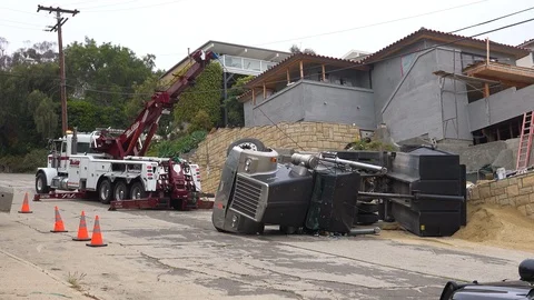 A dump truck rolls over during an accident on a construction site. Vídeos de archivo 107443721
