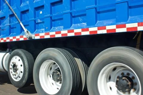 Dump truck through side window of car Foto stock