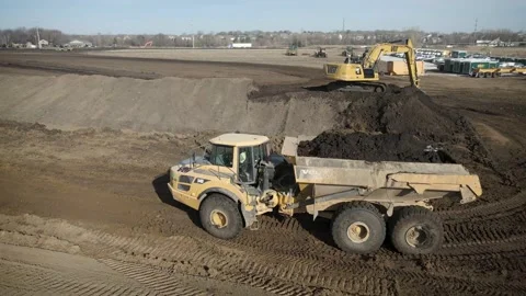 Dump Truck Transporting Dirt Through Construction Site Stock Footage 145377948