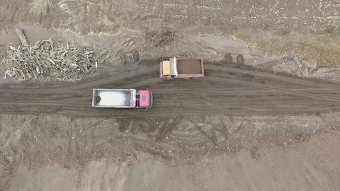 A dump truck transporting ground and the second one are empty Stock Footage 169323865