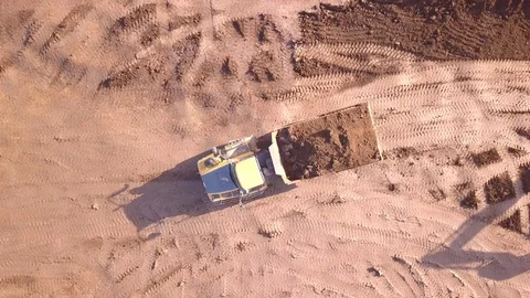 Dump truck transporting soil at a new construction site. Stock Footage 121923850