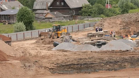 Dump truck unload pit sand into large pile of sand Stock Footage