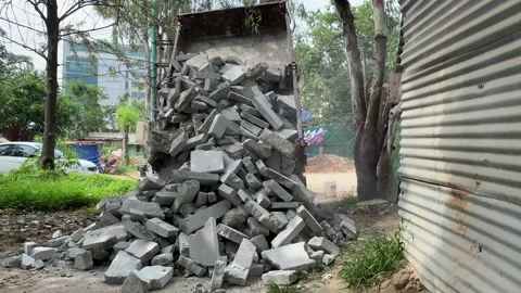 Dump truck unloading conceit dirt at construction site Stock Footage 161990642