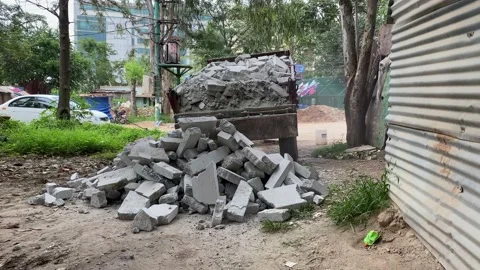 Dump truck unloading conceit dirt at construction site Video stock 161991272