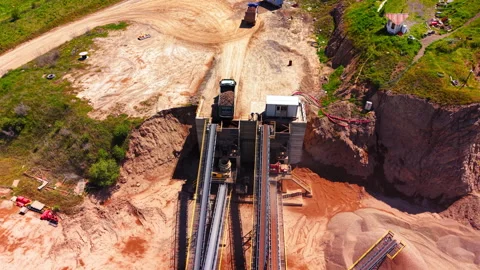 Dump truck unloading crushed stone at processing plant, Bulgaria Stock Footage 336342994