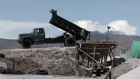 Dump Truck Unloading Salt Into Hopper at Salinas Grandes Salt Flats - 4K Stock Footage 343686756