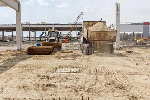 Dump truck is unloading soil. Stock Photos
