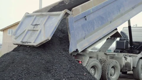 Dump Truck unloads the ground at the construction site. Video stock 73041977