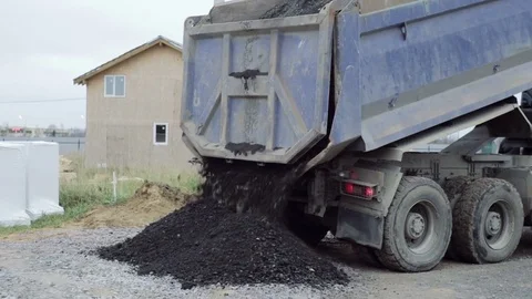 Dump Truck unloads the ground at the construction site. Stock Footage 73042057