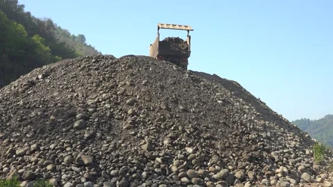 Dump truck unloads sand - Aggregate Material and Construction Machinery Stock Footage 339814205
